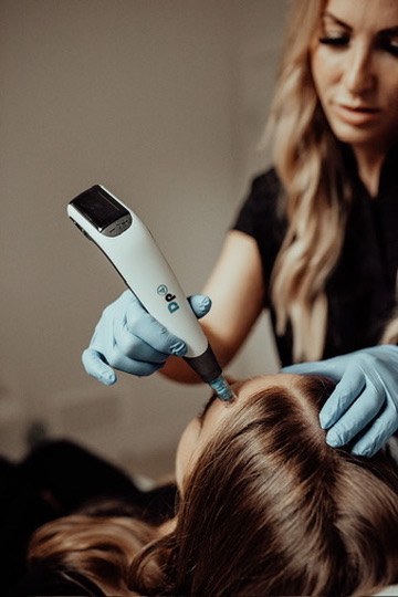 Stephanie Eschak, NP, performing medical-grade microneedling treatment at Juvenescence Wellness in Lake Cowichan, BC